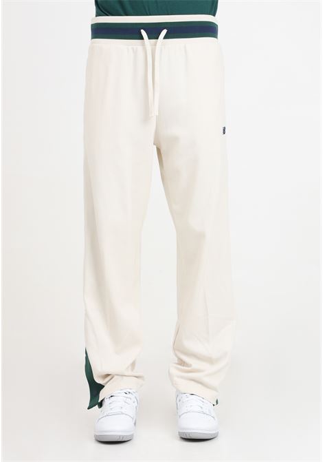 Pantaloni da uomo beige e verdi Sportswear's Greatest Hits Snap Pant NEW BALANCE | MP41504LIN106